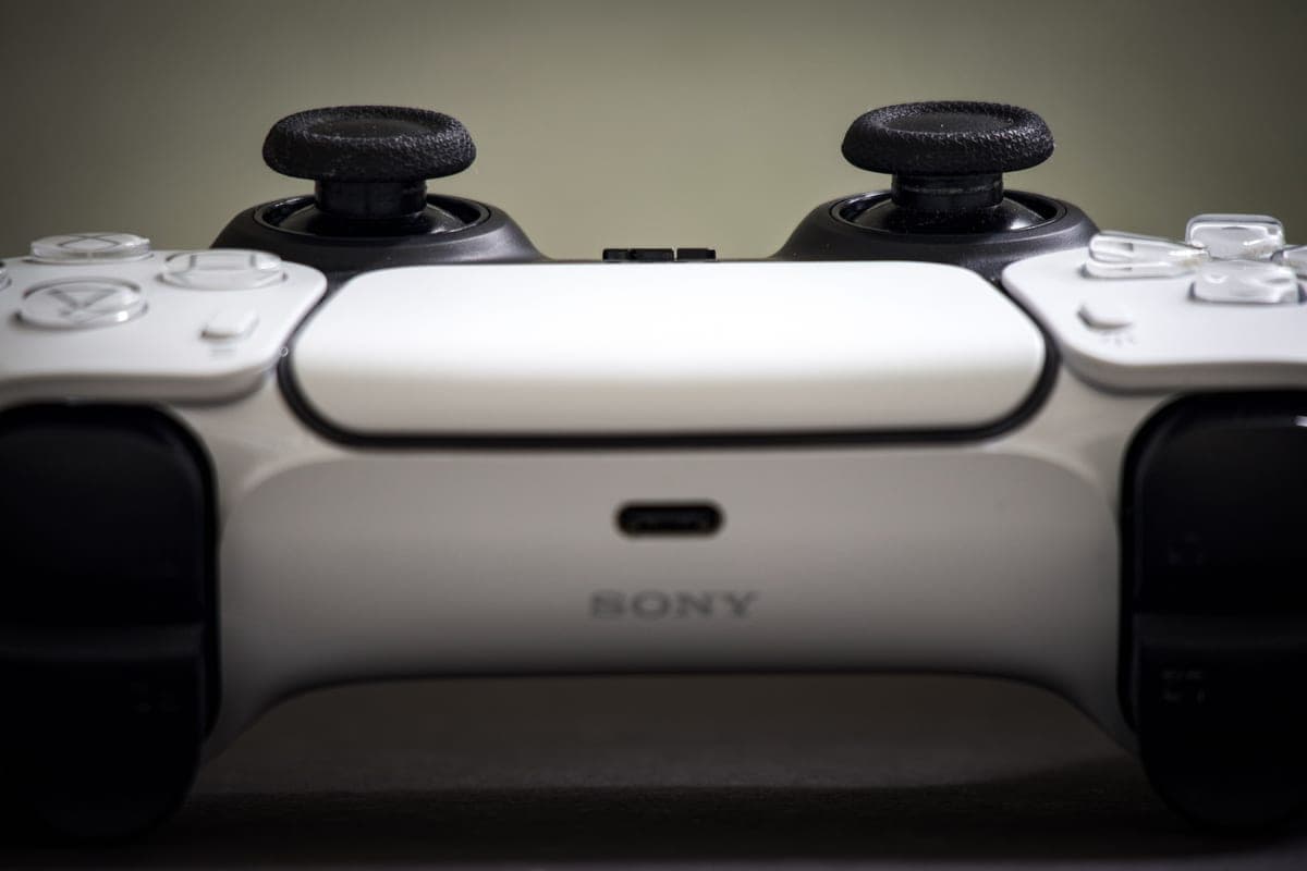 PlayStation controller close-up — cheap PS5 and PS4 game deals