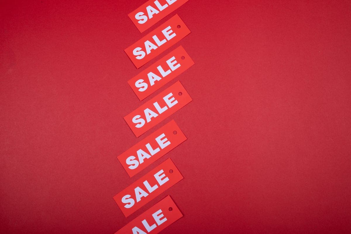 A discount price tag on a game store display — the Steam sale schedule