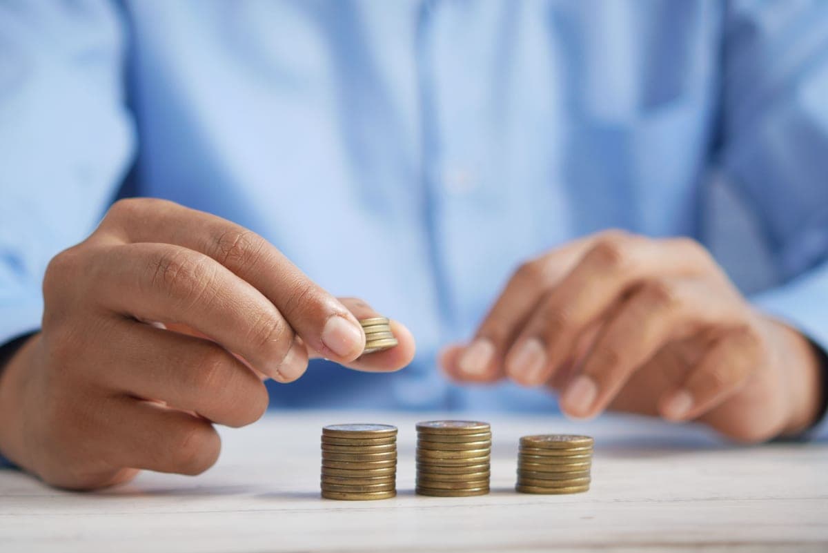 Coins stacked next to a controller — best value games